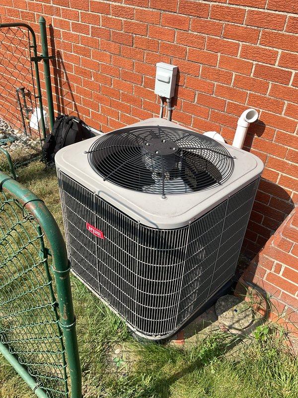 Completed comprehensive Gold AC inspection on 12-year-old single-zone system with basement air handler and outdoor condenser unit. Inspected Bryant humidifier control panel, verified proper operation of outdoor condensing unit with functional fan assembly, examined refrigerant line insulation and electrical disconnect, and documented system components. All equipment operational at time of inspection with no immediate service needs identified.