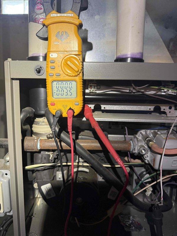 Completed comprehensive tune-up and city certification inspection on 10+ year old furnace system located in basement. Performed combustion efficiency testing using digital multimeter, verified electrical components and connections, inspected gas piping and copper refrigerant lines, and evaluated condensate drainage system including PVC piping and sensor unit. All systems tested within acceptable parameters and equipment certified for continued operation.