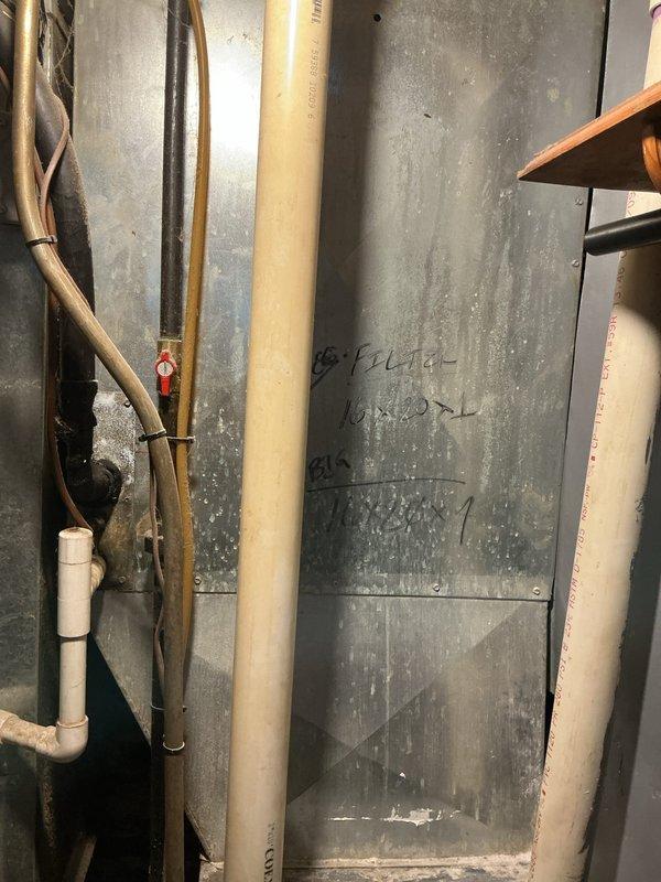Responded to service call for air conditioning system not providing cooling throughout home. Upon inspection of outdoor unit and indoor components, evaluated existing HVAC infrastructure including ductwork, refrigerant lines, and system connections. Documented current system condition through photographs showing aged metal ductwork with visible wear, copper refrigerant lines, and associated piping components. Provided comprehensive estimate for complete AC system replacement due to system age and operational failure.