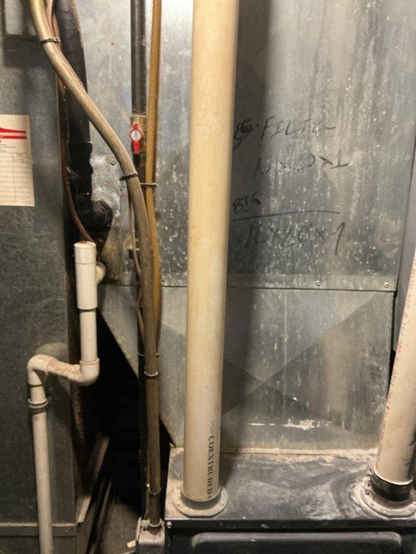 Responded to service call for air conditioning system not providing cooling throughout home. Upon inspection of outdoor unit and indoor components, evaluated existing HVAC infrastructure including ductwork, refrigerant lines, and system connections. Documented current system condition through photographs showing aged metal ductwork with visible wear, copper refrigerant lines, and associated piping components. Provided comprehensive estimate for complete AC system replacement due to system age and operational failure.