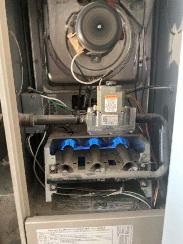 Performed comprehensive tune-up and inspection on 15-year-old York furnace system that had not been serviced since property purchase. Conducted full system diagnostics including inducer motor operation, gas valve assembly inspection, flame sensor evaluation, burner manifold cleaning, and capacitor testing. Replaced dual-run capacitor as preventative maintenance measure, verified all electrical connections, confirmed proper ignition sequence with blue flame sensors, and ensured safe operation of all furnace components for the upcoming heating season.