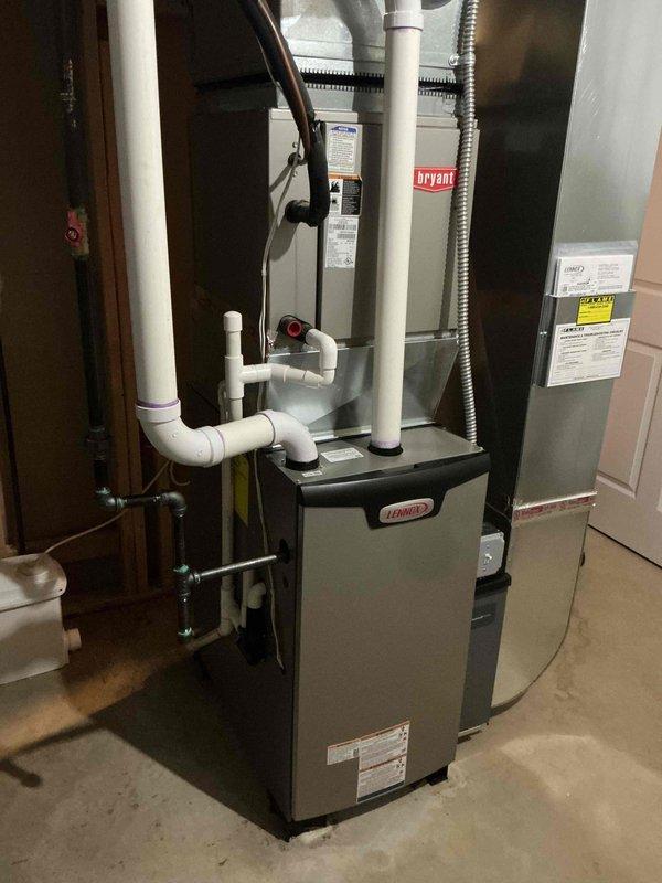 Completed full furnace installation of a 70,000 BTU heating system with all necessary mechanical and electrical connections. Installed Bryant HVAC equipment alongside Lennox furnace unit, including proper PVC venting and condensate drainage systems, flexible metal ductwork connections, and wall-mounted components. Requested mechanical and electrical permits, reconnected electrical service, and ensured customer qualified for utility rebate program.