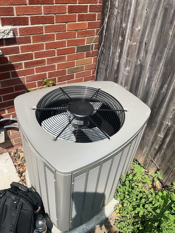 Responded to no cooling complaint on 2-year-old residential air conditioning system. Upon arrival, located outdoor condenser unit at rear of property against wooden fence. Performed diagnostic testing using digital multimeter to assess electrical components and system operation. Identified issue preventing cooling operation. Completed necessary repairs to restore proper system function. Unit tested and verified operating within normal parameters. System now providing adequate cooling as designed.