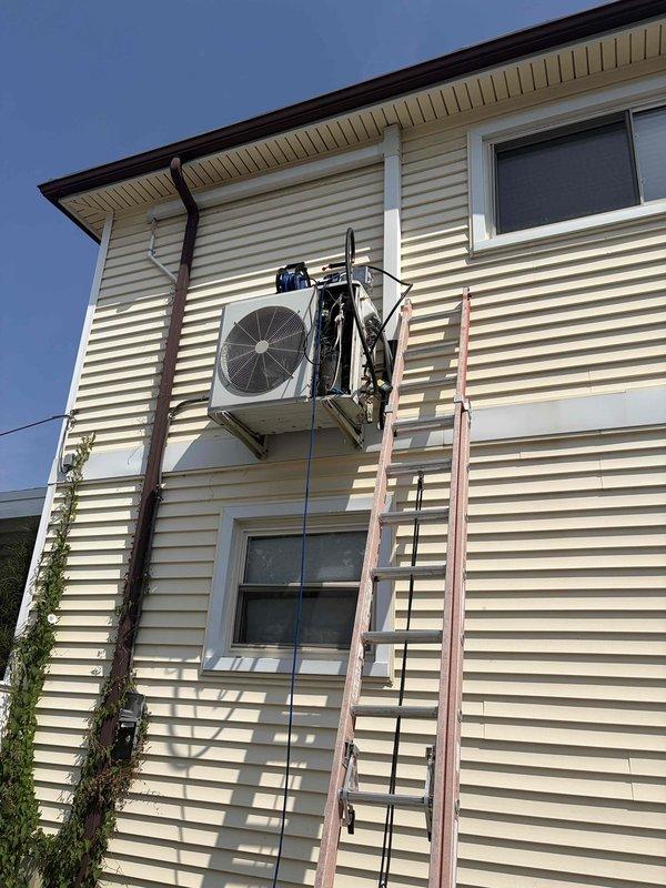Performed comprehensive leak search on mini-split air conditioning system with wall-mounted evaporator coil assembly. Identified failed evaporator coil requiring replacement, which has been ordered under purchase order 1350720-001 with expected arrival in 7 business days. Documented system condition with photographs of indoor air handler unit and outdoor condenser unit for warranty processing and future reference.