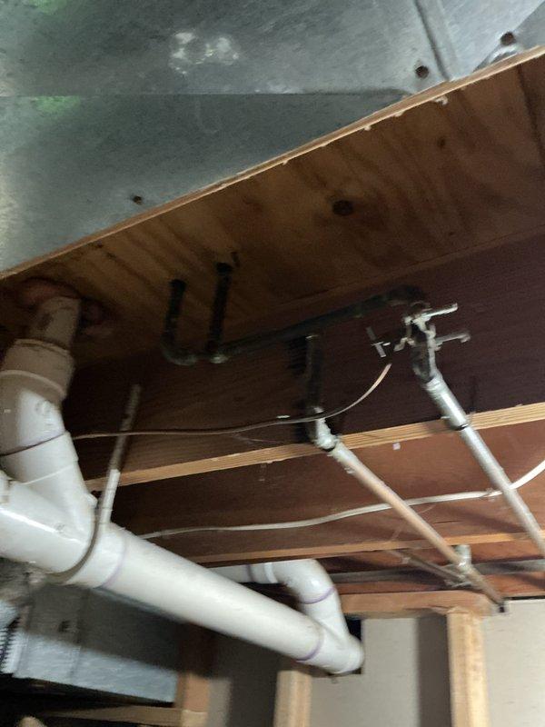 Completed comprehensive Gold AC Inspection and tune-up on a four-year-old air conditioning system located at the rear of the property. Successfully installed an Aprilaire 600M whole-home humidifier, integrating it with the existing HVAC ductwork and establishing proper drainage connections using PVC piping. Performed full system evaluation including refrigerant level check, electrical connections inspection, condensate drain line verification, air filter assessment, and thermostat calibration. All components were found to be operating within manufacturer specifications. The humidifier installation included mounting the unit to the supply plenum, running condensate drain lines to the existing plumbing system, and completing all electrical connections. System tested and confirmed operational upon completion.