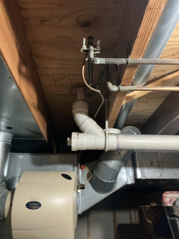 Completed comprehensive Gold AC Inspection and tune-up on a four-year-old air conditioning system located at the rear of the property. Successfully installed an Aprilaire 600M whole-home humidifier, integrating it with the existing HVAC ductwork and establishing proper drainage connections using PVC piping. Performed full system evaluation including refrigerant level check, electrical connections inspection, condensate drain line verification, air filter assessment, and thermostat calibration. All components were found to be operating within manufacturer specifications. The humidifier installation included mounting the unit to the supply plenum, running condensate drain lines to the existing plumbing system, and completing all electrical connections. System tested and confirmed operational upon completion.
