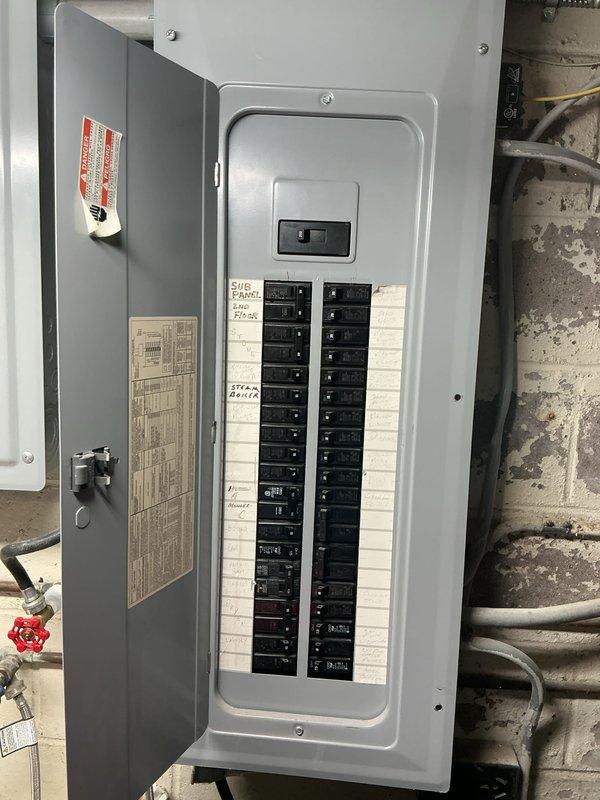 Completed site assessment and electrical estimate for new standby generator installation. Evaluated existing electrical infrastructure including main service panel and subpanel configuration to determine proper integration point for automatic transfer switch. Documented current electrical system layout, circuit loading, and available capacity to support generator interconnection. Photographed existing panel conditions showing circuit breaker arrangement, labeling, and available space for transfer switch wiring modifications required for generator hookup.