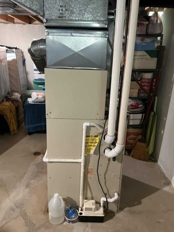 Completed comprehensive HVAC system inspection and full system estimate on 20-year-old Bryant furnace and air conditioning system located in basement. Evaluated existing equipment condition, ductwork configuration, condensate drainage system, and overall system performance to provide replacement recommendations for aging residential heating and cooling system.