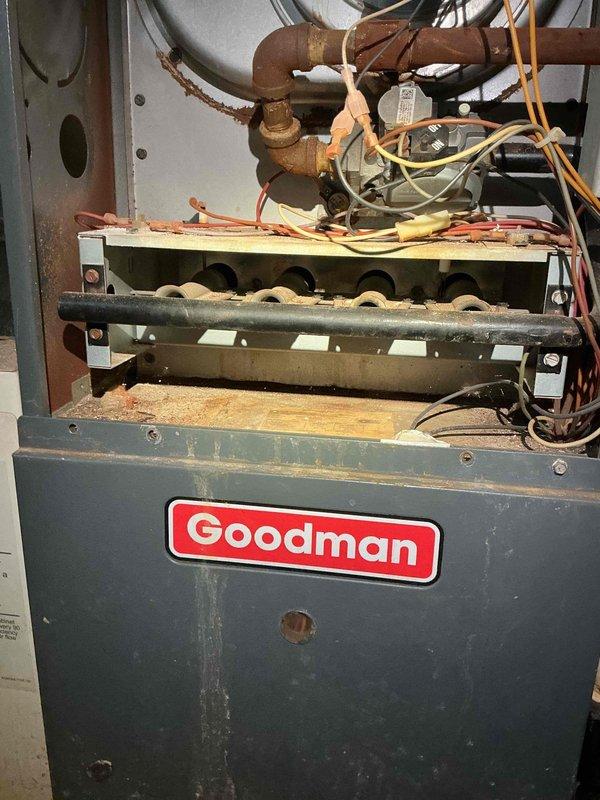 Responded to no-cooling call on 10+ year old Goodman AC unit with non-operational condenser fan. Upon arrival, verified outdoor condenser fan motor was not running despite power to unit. Inspected electrical connections, tested capacitor, and evaluated fan motor for failure. Found fan motor had seized and required replacement. Replaced defective condenser fan motor with OEM equivalent, verified proper rotation and amp draw. Tested system operation through complete cooling cycle. Unit now cooling properly with condenser fan operating within manufacturer specifications.