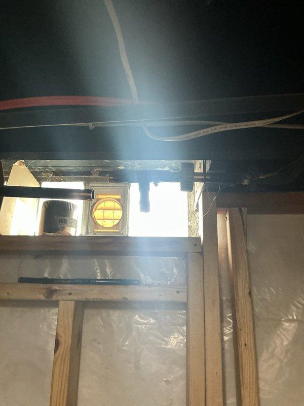 Responded to a slow water leak from a basement pipe that had begun to calcify. Upon inspection, identified the affected piping in the basement ceiling area and assessed the extent of mineral buildup and deterioration. Documented the condition of the plumbing system, including overhead pipe routing and structural access points for future reference and repair planning.