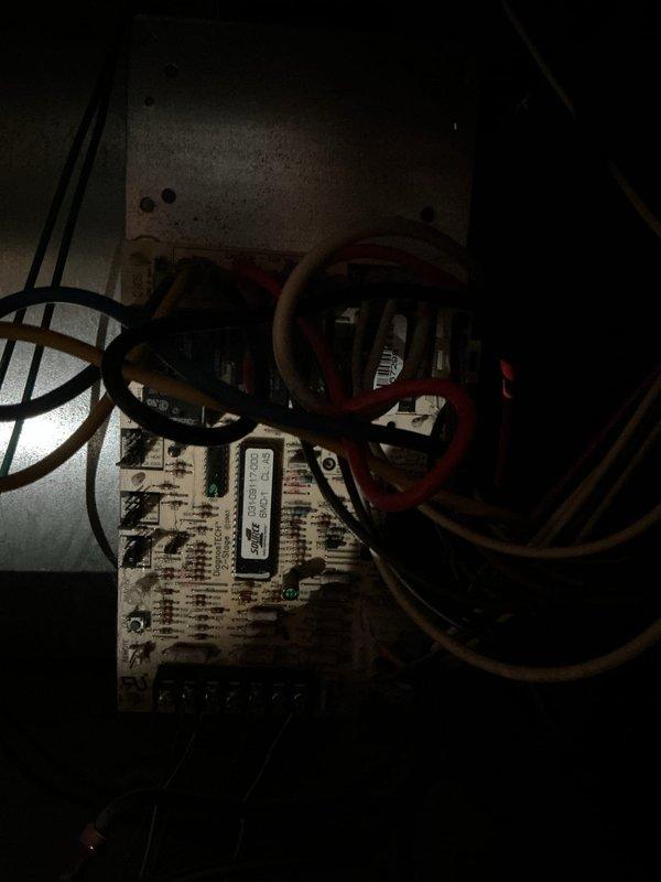 Responded to service call for non-operational AC fan motor in basement-located cooling system. Upon inspection, found 20-year-old fan motor had failed while the 4-year-old condensing unit remained functional. Accessed control board and electrical connections, identified motor failure, and replaced defective fan motor with new unit. Verified all wiring connections at control board, tested system operation, and confirmed proper airflow and cooling function restoration.