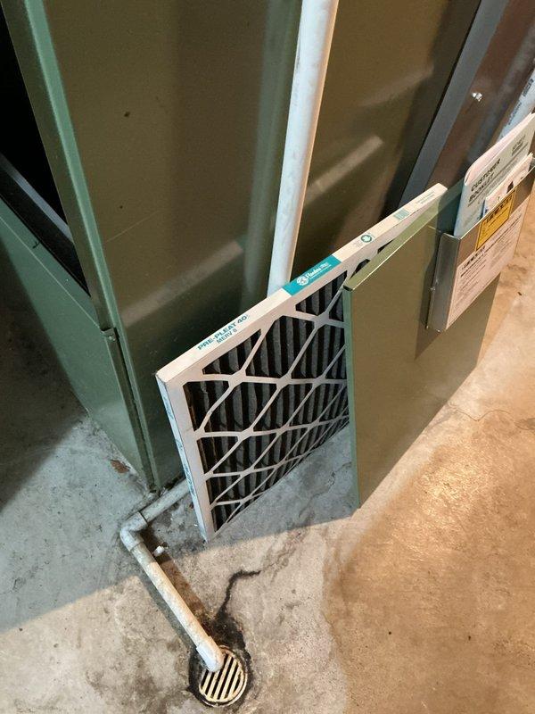 Responded to service call for non-operational AC fan motor in basement-located cooling system. Upon inspection, found 20-year-old fan motor had failed while the 4-year-old condensing unit remained functional. Accessed control board and electrical connections, identified motor failure, and replaced defective fan motor with new unit. Verified all wiring connections at control board, tested system operation, and confirmed proper airflow and cooling function restoration.