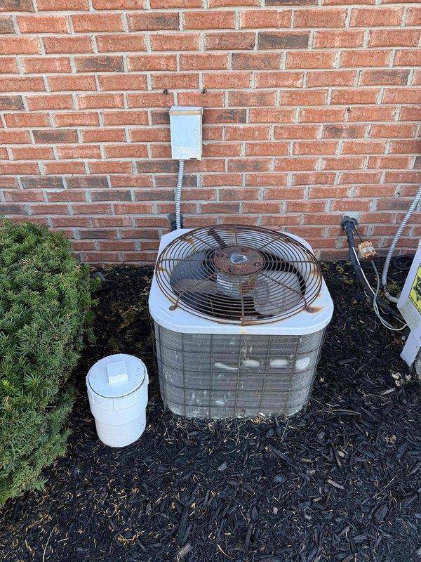 Responded to commercial AC unit with fan running but no cooling. Upon inspection, discovered extensive frost and ice buildup on supply ductwork in mechanical room, indicating refrigerant system failure or airflow restriction. Diagnosed low refrigerant charge as primary cause, resulting in evaporator coil freezing and blocking airflow to conditioned space. System shutdown required to allow coil defrost before proceeding with refrigerant recovery, leak detection, and recharge to restore proper cooling operation.