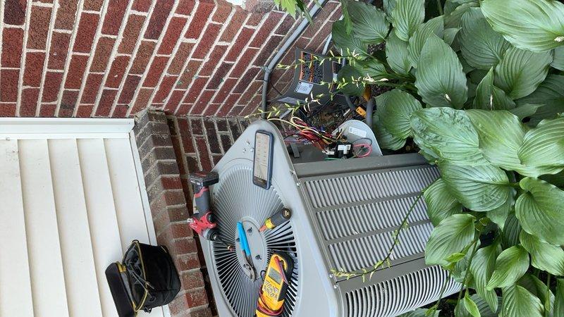 Responded to service call for one-year-old residential AC unit experiencing loud noise during operation while maintaining cooling capacity. Performed diagnostic testing on outdoor condenser unit using multimeter and electrical testing equipment. Inspected electrical disconnect box, verifying all wire connections, fused disconnect switch operation, and proper grounding. Tested voltage and amperage at unit and disconnect to identify source of abnormal sound. Unit found to be cooling properly with all electrical components functioning within normal parameters.