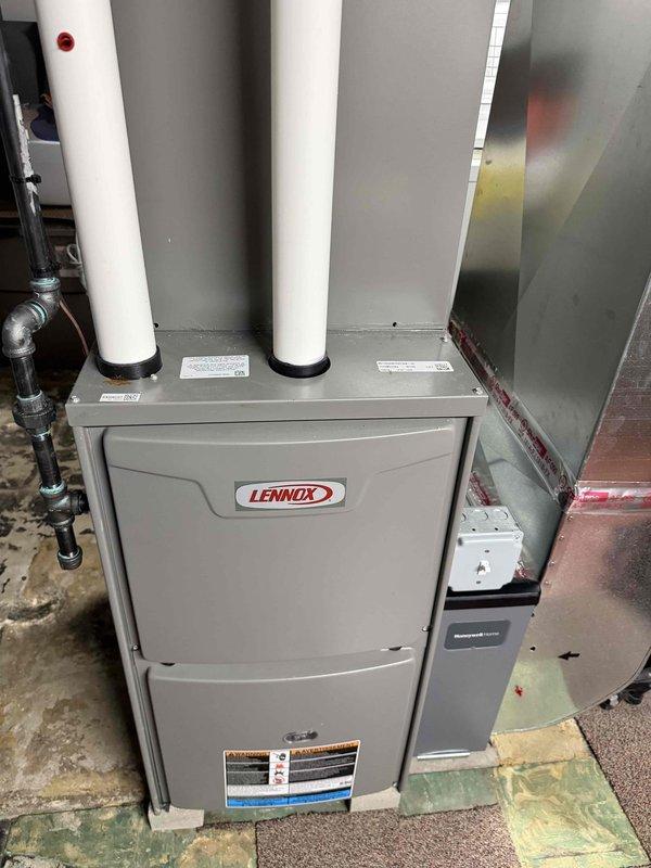 Responded to no cooling complaint on 2-year-old residential AC system affecting entire home. Upon arrival, performed complete system diagnostic including visual inspection of outdoor Lennox condenser unit and indoor furnace/air handler in basement. Condenser unit appeared in good physical condition with clean coils and proper clearances; both copper refrigerant lines showed appropriate insulation with no visible damage or refrigerant leaks at service valves. Verified power supply to both indoor and outdoor units, checked thermostat operation and settings, and measured system pressures and temperatures. Indoor unit connections, electrical components, and ductwork inspected without abnormalities noted. System successfully restored to proper cooling operation and tested through complete cycle to verify adequate airflow and temperature differential across evaporator coil.