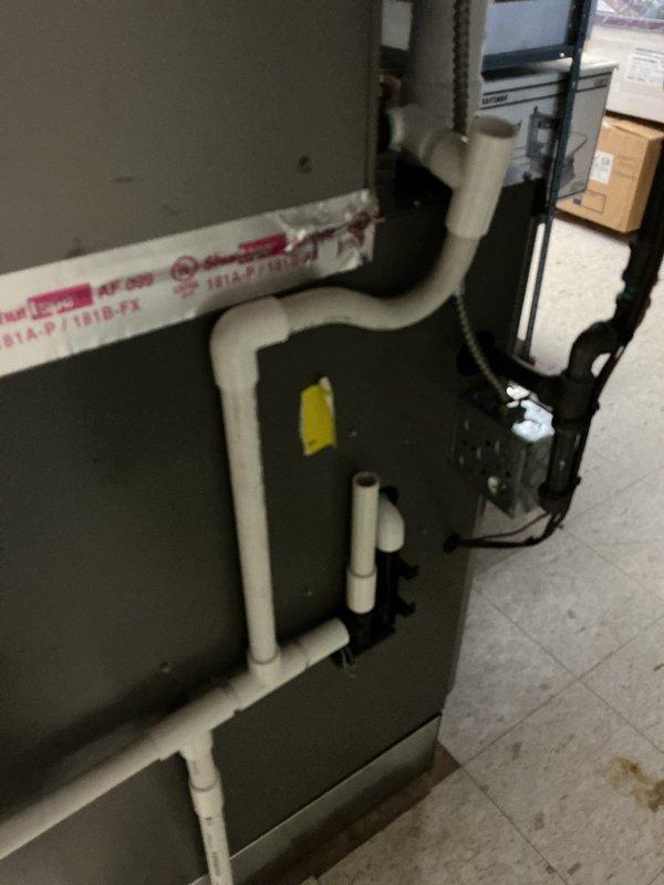 Responded to callback for water leakage issue on less than one-year-old furnace system in basement. Upon inspection, determined evaporator coil orientation was causing improper drainage and interfering with furnace venting. Rotated evaporator coil 180 degrees to correct drain line pitch and ensure proper condensate removal, while also repositioning unit to allow adequate furnace vent clearance. Verified all PVC drain lines and condensate connections were secure and properly sloped. Tested system operation to confirm proper drainage flow and no further water accumulation on basement floor.