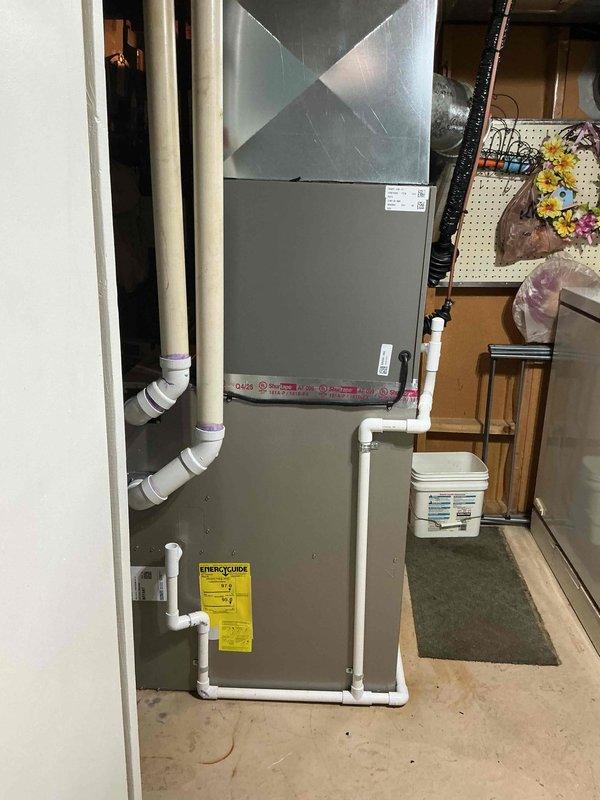 Completed installation of 2-ton air conditioning unit with matching evaporator coil in rear location. Reconnected electrical components per code requirements and installed condensate drain lines with proper PVC piping. System was tested for proper operation, refrigerant charge verified, and all mechanical and electrical connections secured according to manufacturer specifications and local permit requirements.