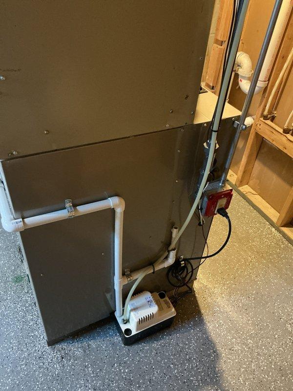 Provided estimate for complete AC replacement of 1994 Bryant system located in basement that currently operates but uses obsolete R22 refrigerant and requires recharge for optimal performance. Evaluated existing gas furnace configuration and assessed basement installation area including current ductwork, PVC drainage system, and condensate pump setup to determine equipment specifications and replacement requirements.