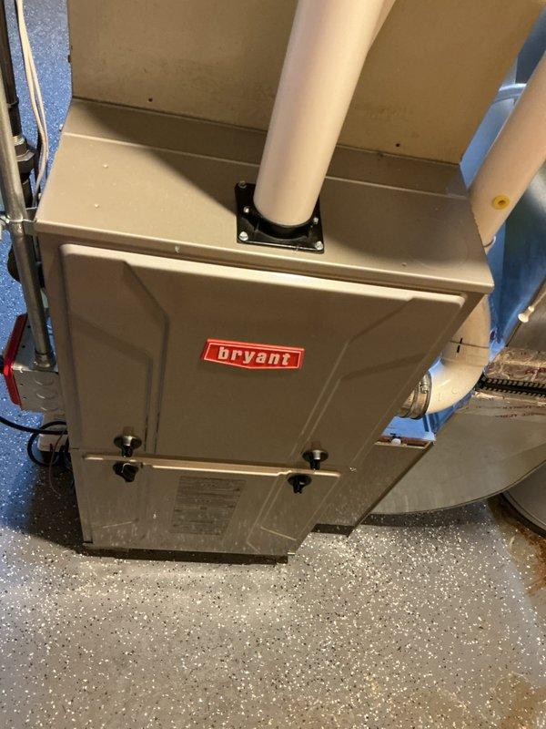 Provided estimate for complete AC replacement of 1994 Bryant system located in basement that currently operates but uses obsolete R22 refrigerant and requires recharge for optimal performance. Evaluated existing gas furnace configuration and assessed basement installation area including current ductwork, PVC drainage system, and condensate pump setup to determine equipment specifications and replacement requirements.