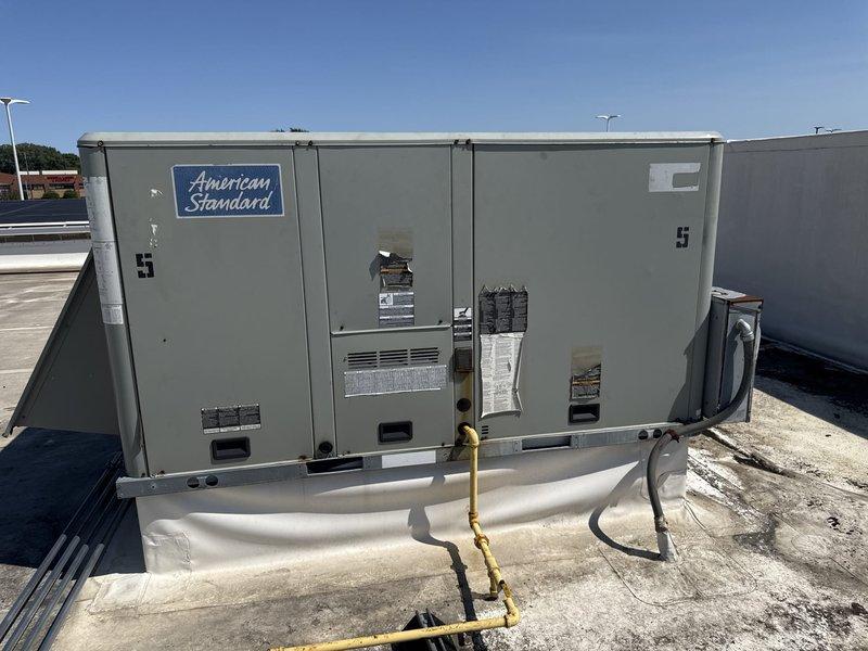 Responded to commercial rooftop unit not cooling properly. Upon inspection, found failed run capacitor preventing compressor operation. Replaced defective capacitor, verified proper electrical connections, and tested system operation. Unit now cooling effectively with all components functioning within manufacturer specifications.