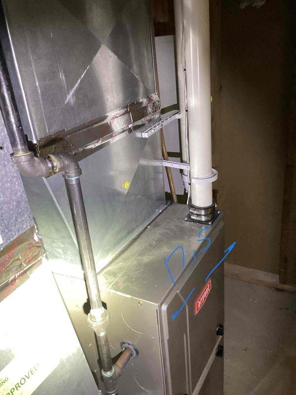 Completed comprehensive HVAC system evaluation for 20-year-old equipment including exterior condensing unit and basement-located furnace/air handler assembly. Documented existing system configuration with metallic ductwork, PVC condensate drainage, and electrical connections to provide replacement estimate for aging residential heating and cooling equipment.