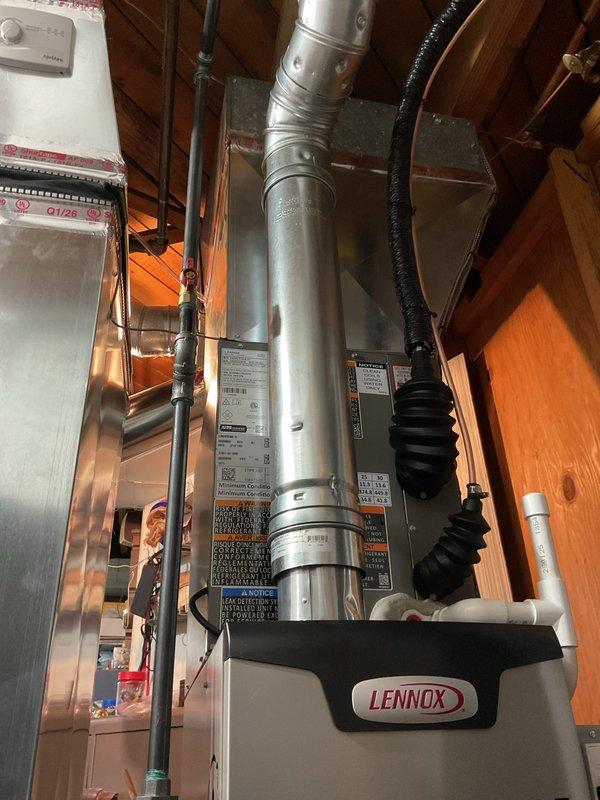 Completed full HVAC system replacement including installation of 70,000 BTU Lennox furnace and 2-ton air conditioning unit in rear yard location. Installed new thermostat, humidifier, and reconnected existing condensate pump. Ran new ductwork and configured system per AHRI certificate 215663106 specifications. Obtained mechanical and electrical permits prior to installation. System tested and verified operational upon completion.