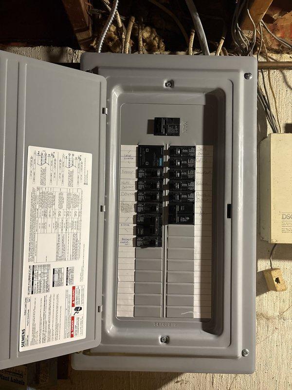 Completed full electrical service upgrade including installation of new main electrical panel in basement utility area. Removed existing outdated service equipment and installed modern circuit breaker panel with proper load distribution across multiple branch circuits. Established new main breaker assembly with appropriate amperage rating, installed individual circuit breakers in organized configuration, and completed all necessary electrical connections using code-compliant wiring methods. Ensured proper grounding and bonding throughout the system, verified all circuits for correct operation, and confirmed safe installation in accordance with current electrical codes. System tested and operational.
