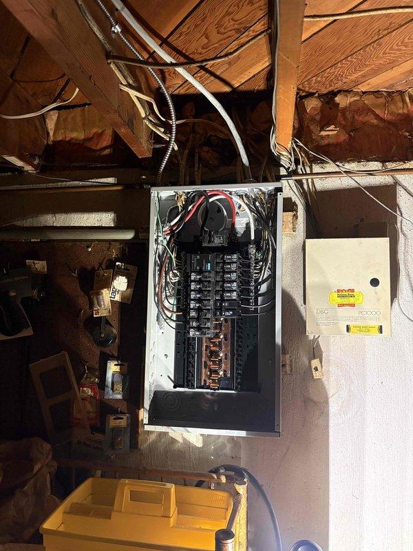 Completed full electrical service upgrade including installation of new main electrical panel in basement utility area. Removed existing outdated service equipment and installed modern circuit breaker panel with proper load distribution across multiple branch circuits. Established new main breaker assembly with appropriate amperage rating, installed individual circuit breakers in organized configuration, and completed all necessary electrical connections using code-compliant wiring methods. Ensured proper grounding and bonding throughout the system, verified all circuits for correct operation, and confirmed safe installation in accordance with current electrical codes. System tested and operational.