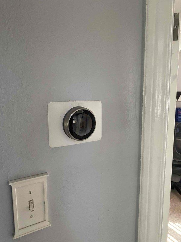 Conducted equipment assessment for non-functioning air conditioning system replacement estimate at residential property with older existing unit. Evaluated current installation including interior thermostat location and existing ductwork and piping configuration in mechanical space to determine replacement specifications and system requirements.