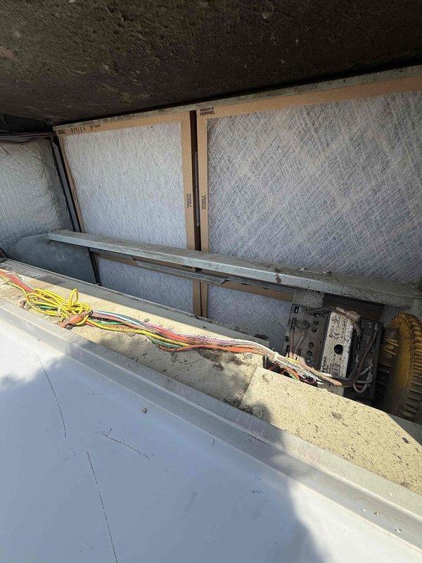 Completed comprehensive inspection of single rooftop AC unit accessed via ladder. Performed visual assessment of RTU components, checked refrigerant lines, electrical connections, and mechanical systems per owner-required certification standards. Documented equipment condition with interior crawl space and exterior rooftop photographs showing unit location, surrounding infrastructure, and accessible service areas. All inspection criteria met and unit found operational within normal parameters.
