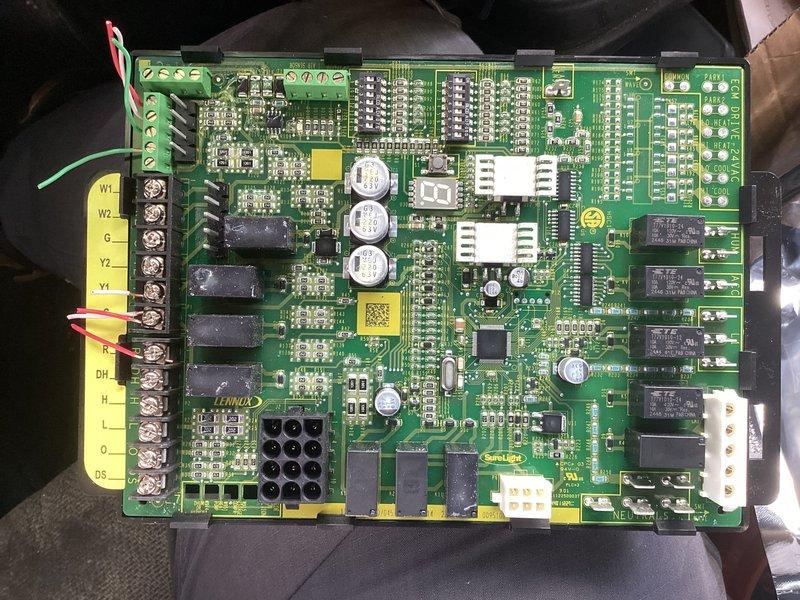 Completed return repair service call to replace defective control board on HVAC system. Removed failed Lennox TIBA-610 control board (part number 107045-01 REV 1.14) and installed new replacement unit. Verified proper wire connections to terminal block including thermostat connections (W1, W2, G, Y2, Y1, R) and system control wiring (DH, H, L, O, BS). Tested all relay functions and system operations to confirm successful board replacement and proper system functionality.
