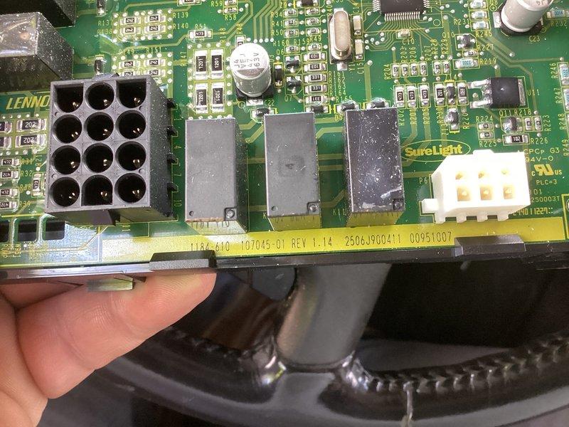 Completed return repair service call to replace defective control board on HVAC system. Removed failed Lennox TIBA-610 control board (part number 107045-01 REV 1.14) and installed new replacement unit. Verified proper wire connections to terminal block including thermostat connections (W1, W2, G, Y2, Y1, R) and system control wiring (DH, H, L, O, BS). Tested all relay functions and system operations to confirm successful board replacement and proper system functionality.