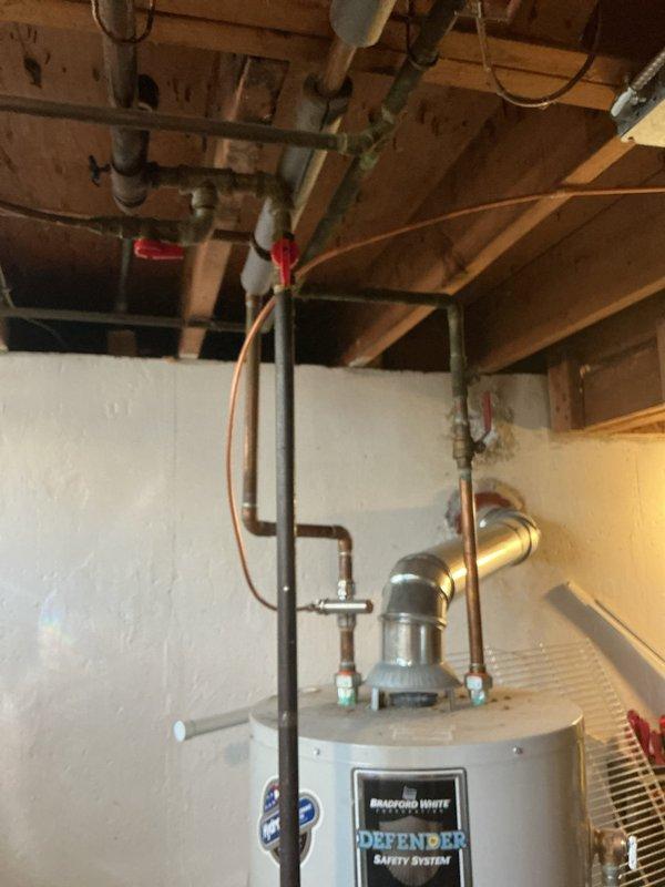 Responded to service call for Bradford White Defender Safety System tanked water heater with extinguished pilot light. Upon inspection, successfully relit pilot light and verified proper flame operation and burner function. Confirmed all safety systems operational, tested temperature pressure relief valve, and inspected gas supply connections and venting system for proper operation.