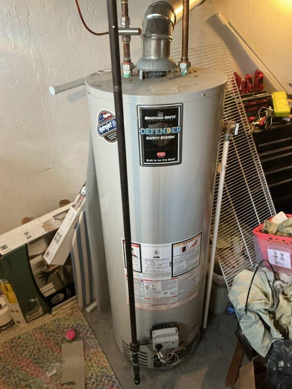 Responded to service call for Bradford White Defender Safety System tanked water heater with extinguished pilot light. Upon inspection, successfully relit pilot light and verified proper flame operation and burner function. Confirmed all safety systems operational, tested temperature pressure relief valve, and inspected gas supply connections and venting system for proper operation.