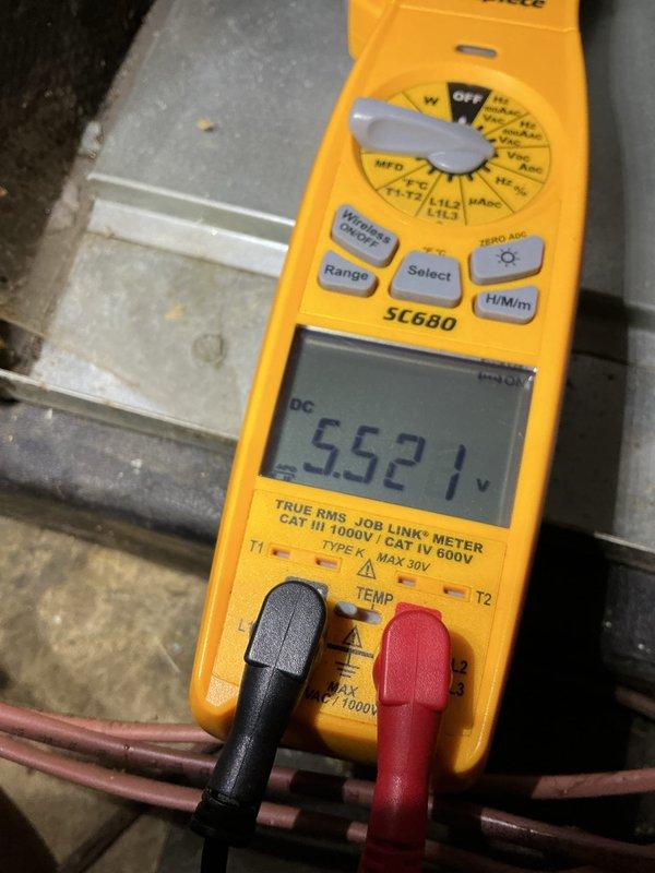 Responded to no cooling call on 5-year-old AC unit located in basement. Upon arrival, confirmed system was completely non-operational with no power to outdoor condensing unit. Performed electrical diagnostics using digital multimeter to test voltage at disconnect and contactor. Measured incoming line voltage at 122V and 552V on separate circuits, indicating power supply issues. Traced electrical fault to failed contactor preventing compressor and condenser fan operation. Replaced defective contactor, verified proper voltage readings across all terminals, and restored power to unit. Cycled system through complete startup sequence, confirmed compressor engagement and proper amperage draw. Tested thermostat communication and verified cooling cycle initiated correctly. System returned to normal operation with adequate airflow and temperature differential.