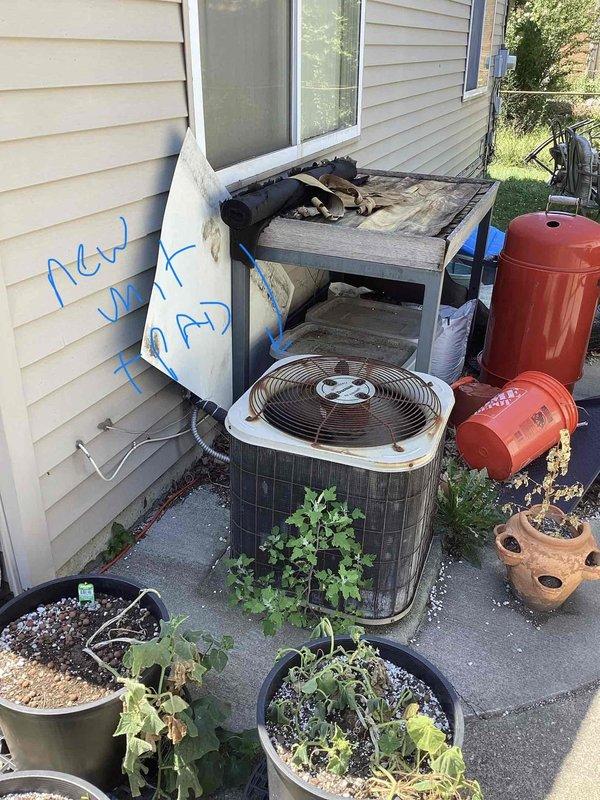 Conducted comprehensive replacement estimate for 28-year-old HVAC system including both furnace and air conditioning components located in utility room. Evaluated existing cylindrical outdoor condenser unit with protective metal grille and assessed indoor air handler with associated ductwork and refrigerant lines. Documented equipment age, current installation configuration, and provided replacement recommendations for aging system that has exceeded typical service life expectancy.