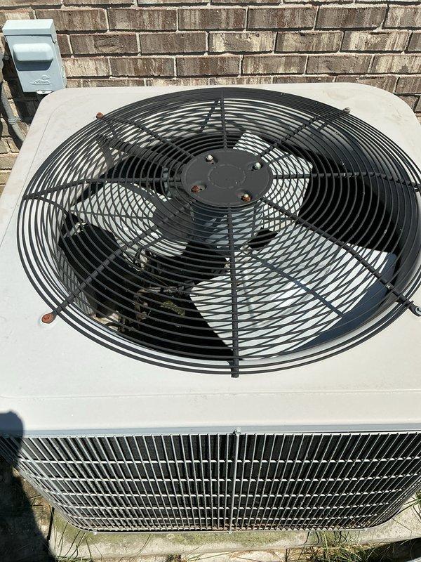 Completed comprehensive Gold AC inspection on 4-year-old residential split system with basement-mounted furnace and evaporator coil, and outdoor condensing unit. Performed thorough visual assessment of outdoor condenser unit, confirming proper fan operation, intact protective grille, and functional electrical disconnect. Inspected indoor furnace and air handler components, noting 96 AFUE-rated unit with accessible blower motor assembly and electrical connections. Observed existing copper refrigerant line showing surface corrosion and rust patina during interior inspection. All major system components including blower motor, gas controls, wiring harnesses, and condensate drainage verified as operational. System confirmed working properly at time of inspection with homeowner present.