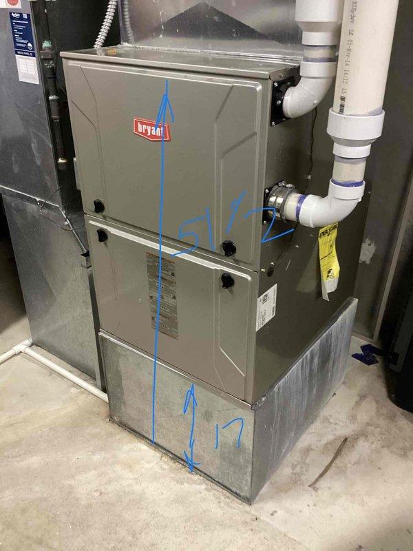 Responded to service call for air conditioning system not cooling properly with thermostat indicating temperature rising during cooling cycle. Upon inspection, discovered water leakage and ice buildup on refrigerant line exiting to outdoor unit, indicating potential evaporator coil freeze-up due to restricted airflow or low refrigerant charge. Documented existing Bryant HVAC system configuration in basement mechanical room and provided comprehensive estimate for complete system replacement, including discussion of possible zoned system installation to address cooling distribution concerns.