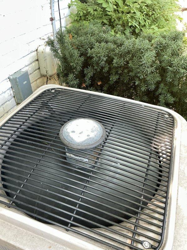 Performed routine maintenance service on 2009 air conditioning system that was operational but running with excessive cycle times. Inspected outdoor condenser unit located in backyard, verified proper airflow through top grille and fan operation, and assessed overall system performance. Examined indoor evaporator coil assembly located near furnace in basement area. Conducted visual inspection of Generac standby generator unit in backyard. Documented equipment conditions with photos including GeneralAire humidifier system requiring annual canister replacement per manufacturer specifications. System evaluated for efficiency optimization and proper operation of all components.