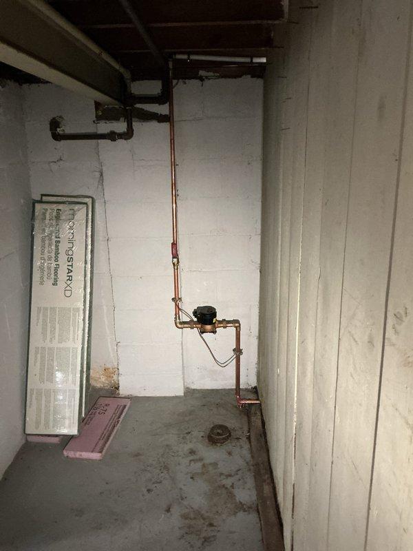Completed full water heater replacement with Bradford White unit in basement utility area, coordinating with city-scheduled water shut off. Installation included proper reconnection of copper supply lines, pressure relief valve, expansion tank mounting, and all required plumbing connections per code specifications. System tested and verified operational upon completion.