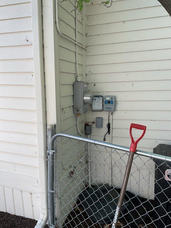 Completed installation of 2-ton packaged rooftop unit (RTU) in rear yard area. Unit installed on prepared concrete pad with proper electrical disconnect and conduit routing along building exterior. All mechanical and electrical connections completed, system tested and operational, with permits requested for mechanical and electrical work per code requirements.