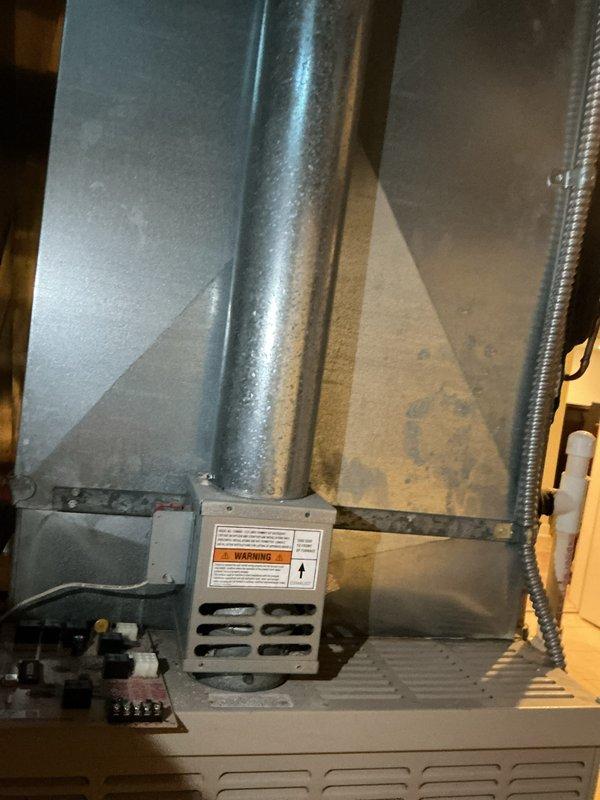 Responded to service call for air conditioning system not providing cold air despite blower and outdoor unit operation. Upon inspection, diagnosed 10-year-old R-22 system with low refrigerant charge. Observed significant condensation on supply ductwork indicating temperature differential issues. Evaluated indoor furnace cabinet and air handler components along with outdoor condensing unit located behind residence. Due to age of equipment, R-22 phase-out, and system condition, provided comprehensive full system replacement estimate for modern high-efficiency HVAC equipment to restore proper cooling function throughout home.