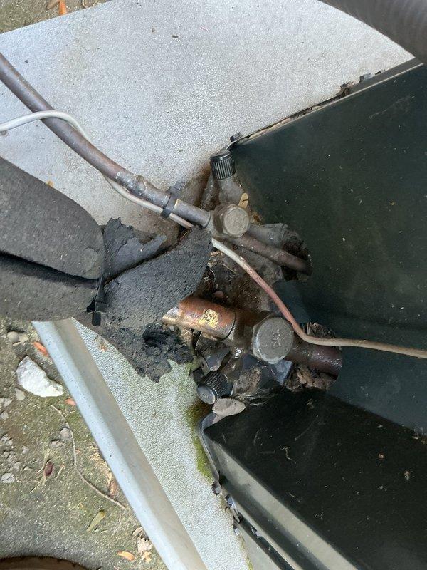 Responded to service call for central air conditioning unit with freezing refrigerant lines and continuously running outdoor fan. Upon inspection, found severely corroded copper refrigerant lines and deteriorated connections on outdoor condenser unit, contributing to system malfunction. Diagnosed low refrigerant charge causing evaporator coil to freeze and preventing proper system cycling. Recovered remaining refrigerant, replaced deteriorated line set sections and corroded fittings, pressure tested system for leaks, evacuated to proper vacuum levels, and recharged unit to manufacturer specifications. Verified proper fan cycling operation, confirmed adequate airflow across coils, and tested system performance under normal operating conditions. Unit restored to full cooling capacity with proper thermostat control and automatic fan cycling.