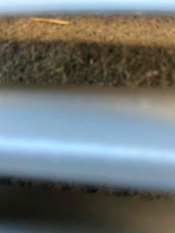 Responded to service call for 2-year-old air conditioning system experiencing loud grinding noise. Inspected outdoor condenser unit in backyard and indoor air handler components in basement. Performed electrical diagnostics using multimeter to verify system voltage and amperage readings. Identified failing condenser fan motor bearing as source of grinding noise. Examined refrigerant line insulation and connections for secondary issues. Unit covered under manufacturer warranty; advised customer of warranty claim process for motor replacement. System temporarily shut down to prevent further damage until replacement part arrives.