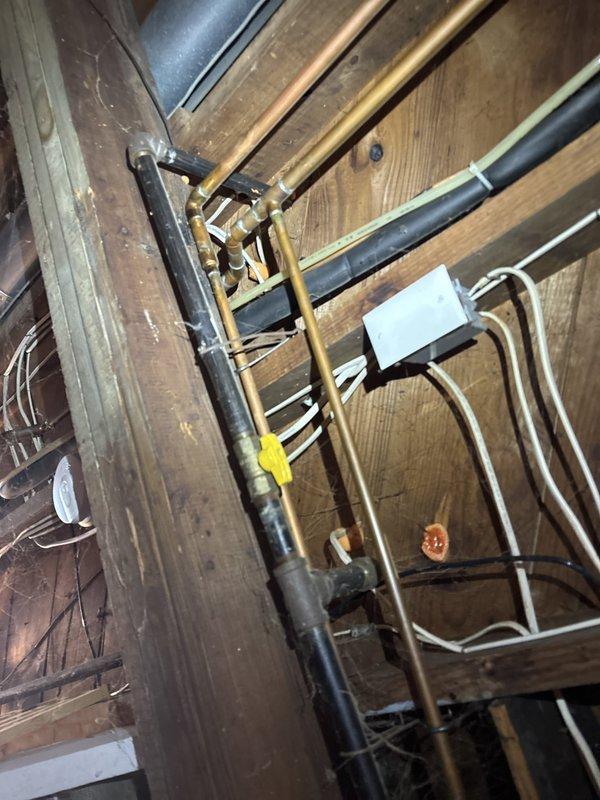 Converted kitchen stove from gas to electric by installing a new four-prong 240V outlet to accommodate the electric range. Replaced existing gas valve in the crawl space with updated valve assembly, capping off the gas line to the stove location. Ran appropriate gauge wiring from the electrical panel to the new outlet location, ensuring proper circuit protection and compliance with code requirements for electric range installation. Verified all electrical connections were secure and tested the new outlet for proper voltage and grounding. Confirmed gas line valve was properly shut off and secured.