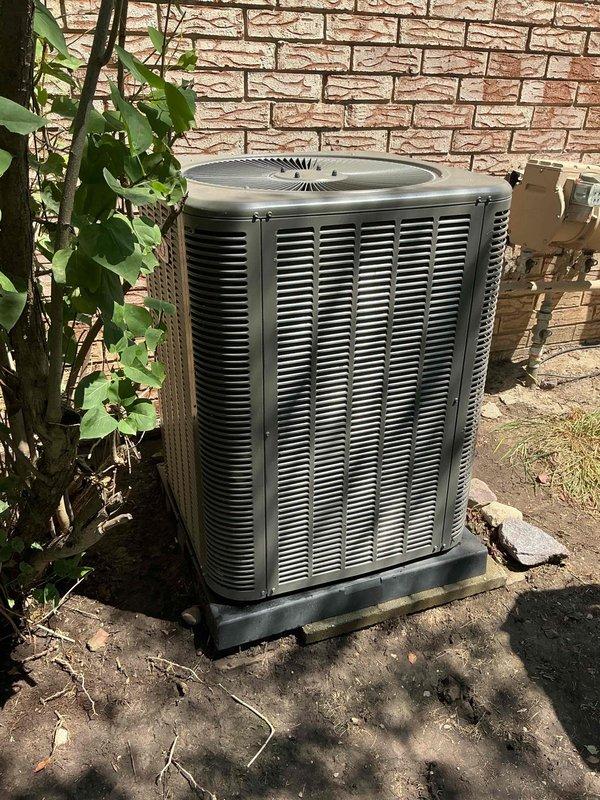 Completed comprehensive Gold AC Inspection on a 2-year-old residential split system with air handler located in basement and condenser unit positioned on exterior concrete pad. Performed full system evaluation including visual inspection of indoor furnace/air handler assembly with refrigerant line connections, ductwork routing, and associated components. Inspected outdoor condenser unit for proper operation, clearance requirements, and overall condition. System found to be in good working order with no immediate service needs identified. All equipment photographed and documented for maintenance records.
