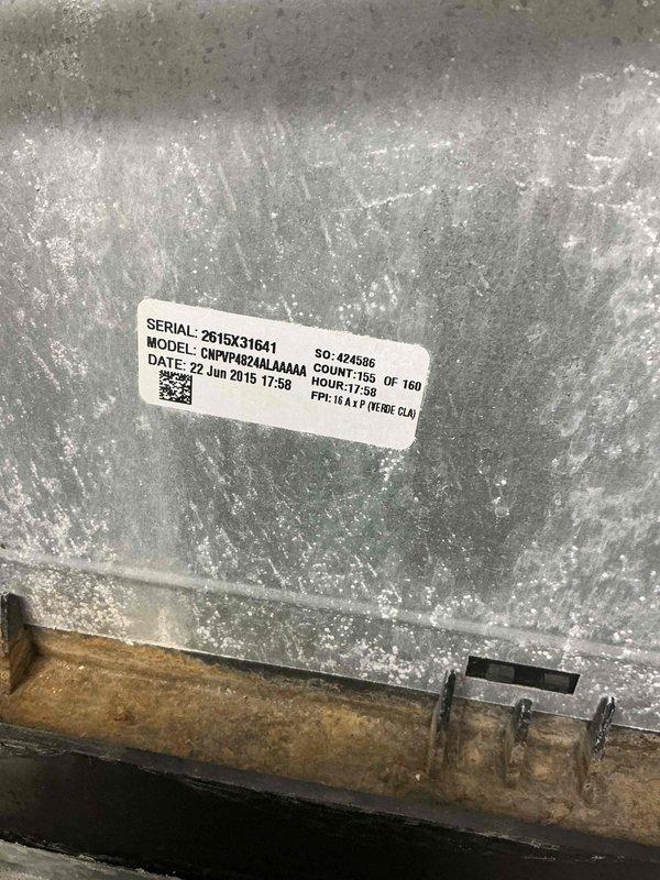 Responded to service call for leak search on CMVP4824AA4A4A air conditioning system manufactured in June 2015. Upon inspection, discovered significant white crystalline buildup and mineral deposits covering evaporator coil and metal surfaces, indicating prolonged refrigerant leak and moisture accumulation. Accessed interior evaporator coil assembly through service panel and documented extensive frosting on aluminum tube serpentine heat exchanger. Observed condensation on PVC drain lines with visible moisture present throughout system. Photographed equipment nameplate and internal components showing corrosion on mounting brackets and hardware. System required management consultation prior to presenting findings and repair recommendations to property owner due to extent of leak damage and potential need for coil replacement or major refrigerant system repairs.
