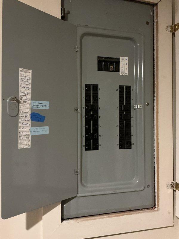 Responded to service call for basement air conditioning unit failing to maintain adequate cooling during hot weather. Upon arrival, verified thermostat display showing 80°F indoor temperature and confirmed system was running but not achieving setpoint. Performed diagnostic evaluation of AC system including visual inspection of indoor and outdoor components, electrical panel verification, and system performance assessment. Documented current operating conditions with photographs of thermostat readings and electrical panel configuration for service records.