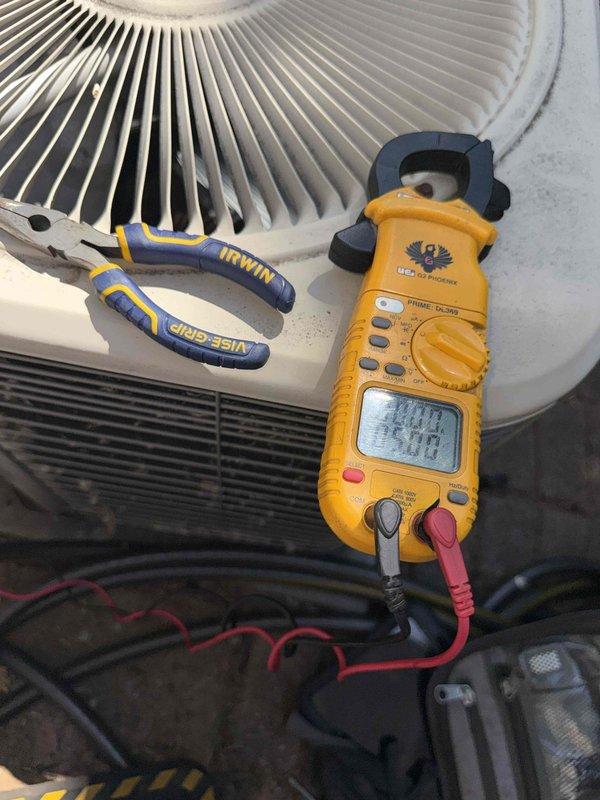 Responded to no cooling complaint on 10+ year old first floor air conditioning system. Upon arrival, performed electrical diagnostics on outdoor condensing unit using clamp meter to measure amperage draw and verify compressor operation. Unit evaluated and electrical measurements recorded to determine system performance and identify cause of cooling failure.