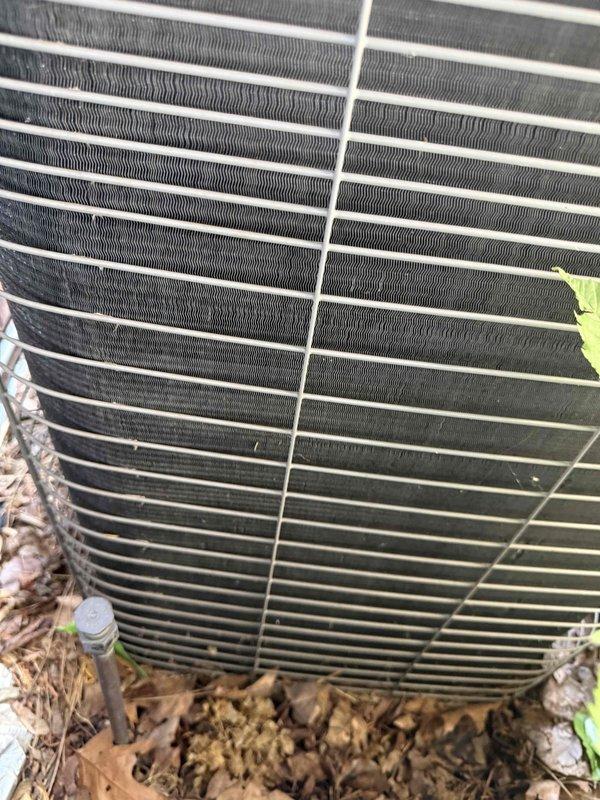 Responded to service call for 10+ year old cooling system located in basement. Assessed condenser unit with failed fan motor and provided quote for replacement motor and installation. Inspected outdoor condenser unit showing normal wear with debris accumulation around base, and examined interior electrical components including dual-run capacitor with proper wire connections. Coordinated parts availability through supplier and prepared equipment for scheduled motor replacement upon customer approval.